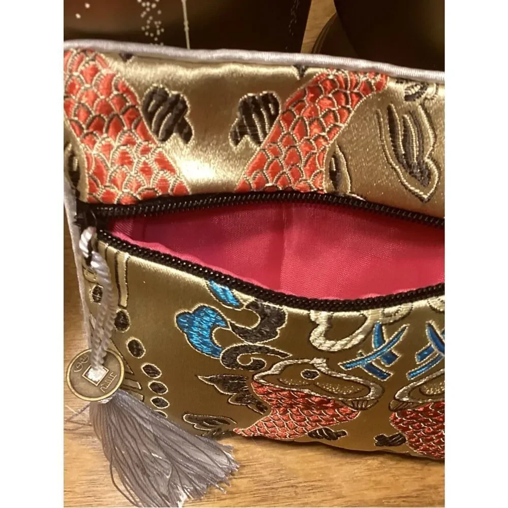 NWT. Gold Embroidered Fish Tassel Wristlet Clutch